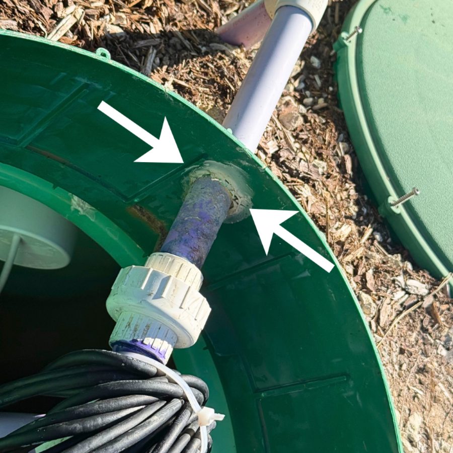 Unsealed gap around the PVC pump line where it passes through a septic riser lid, letting rainwater into the pump tank