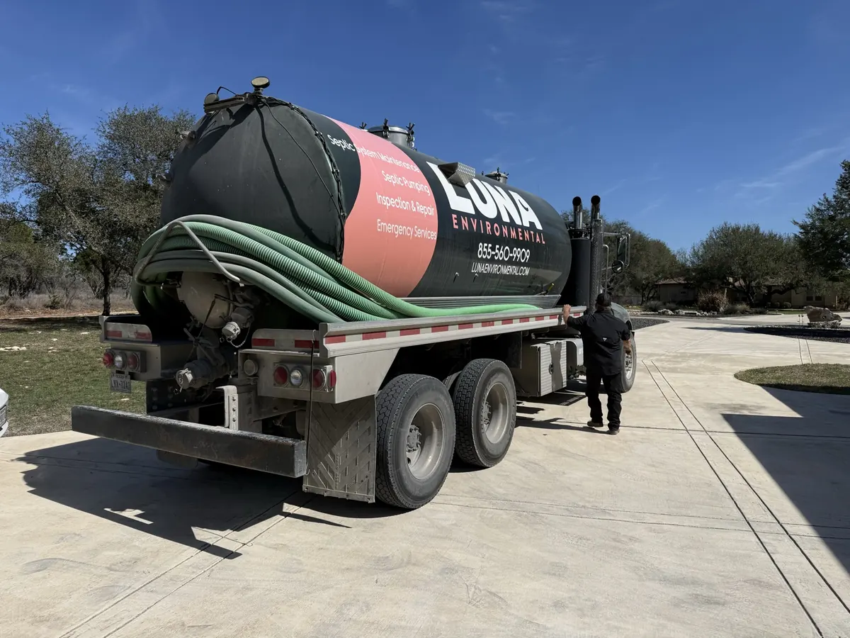 Luna Environmental septic pump truck parked on a Central Texas driveway